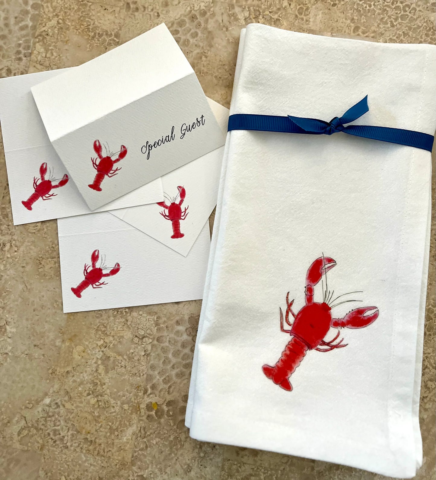 Lobster illustrated tea towel and matching note cards with nature-inspired design