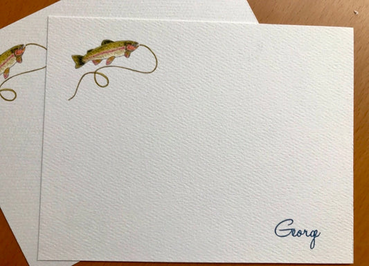 Blank note card with illustrated fish and fishing line, textured paper, and handwritten name