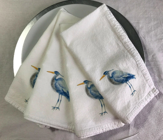 White cloth napkins with blue heron illustration, Happenstance Creations eco-friendly design