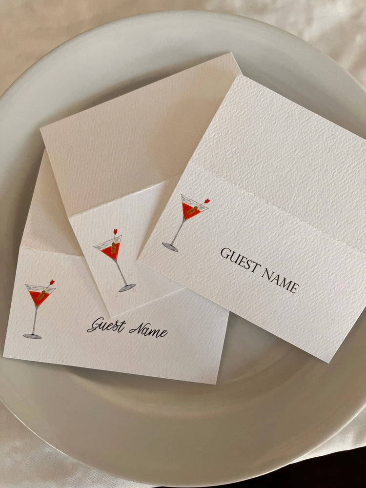Happenstance Creations cocktail-themed place cards with martini illustration on a dinner plate