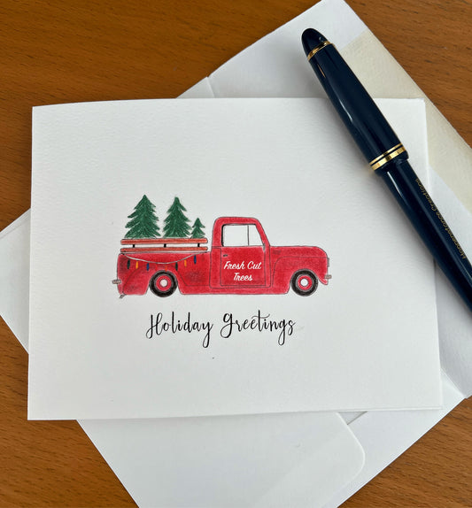 Holiday greetings card with red truck carrying Christmas trees, festive design for seasonal gifting