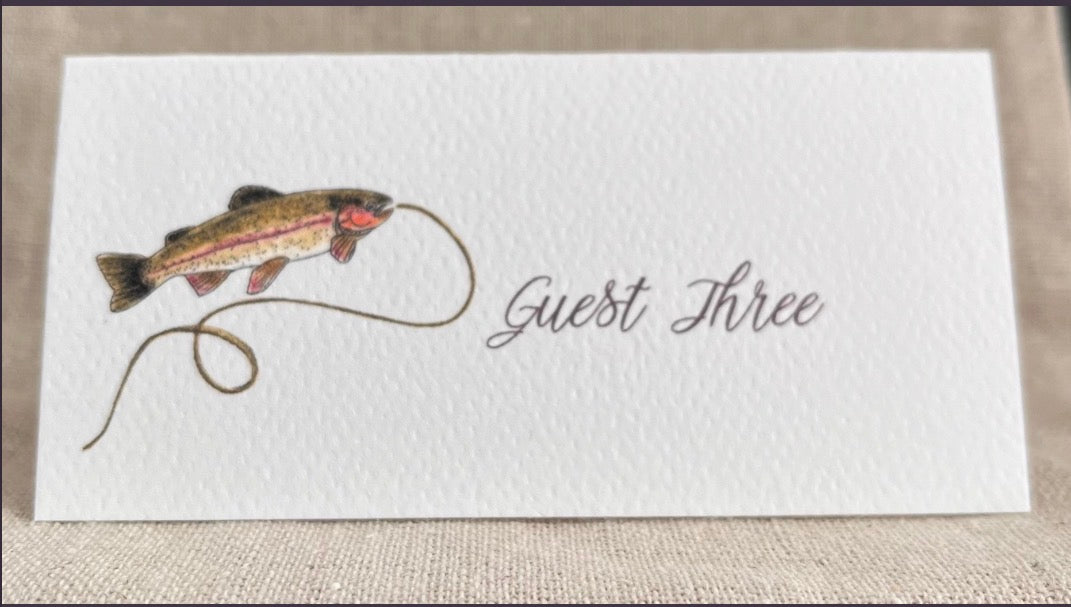 Fish illustration on tented name card for Guest Three, nature-inspired design for gatherings