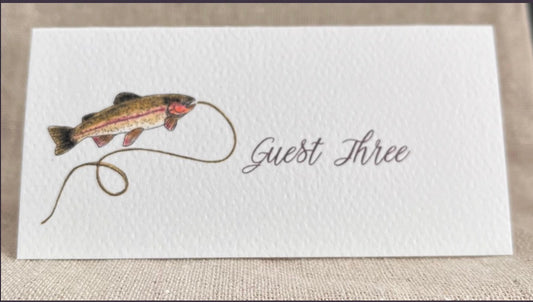 Fish illustration on tented name card for Guest Three, nature-inspired design for gatherings