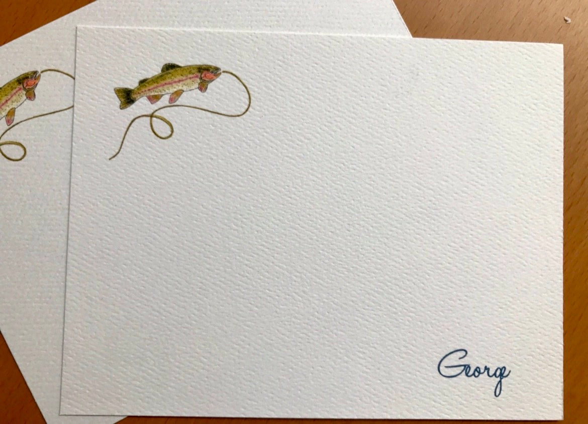 Blank note card with illustrated fish and fishing line, textured paper, and handwritten name