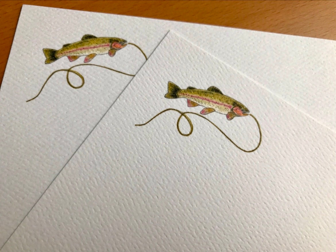 Illustrated note cards with a trout and fishing line design on textured white paper