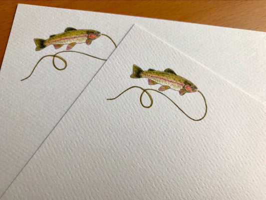 Illustrated note cards with a trout and fishing line design on textured white paper