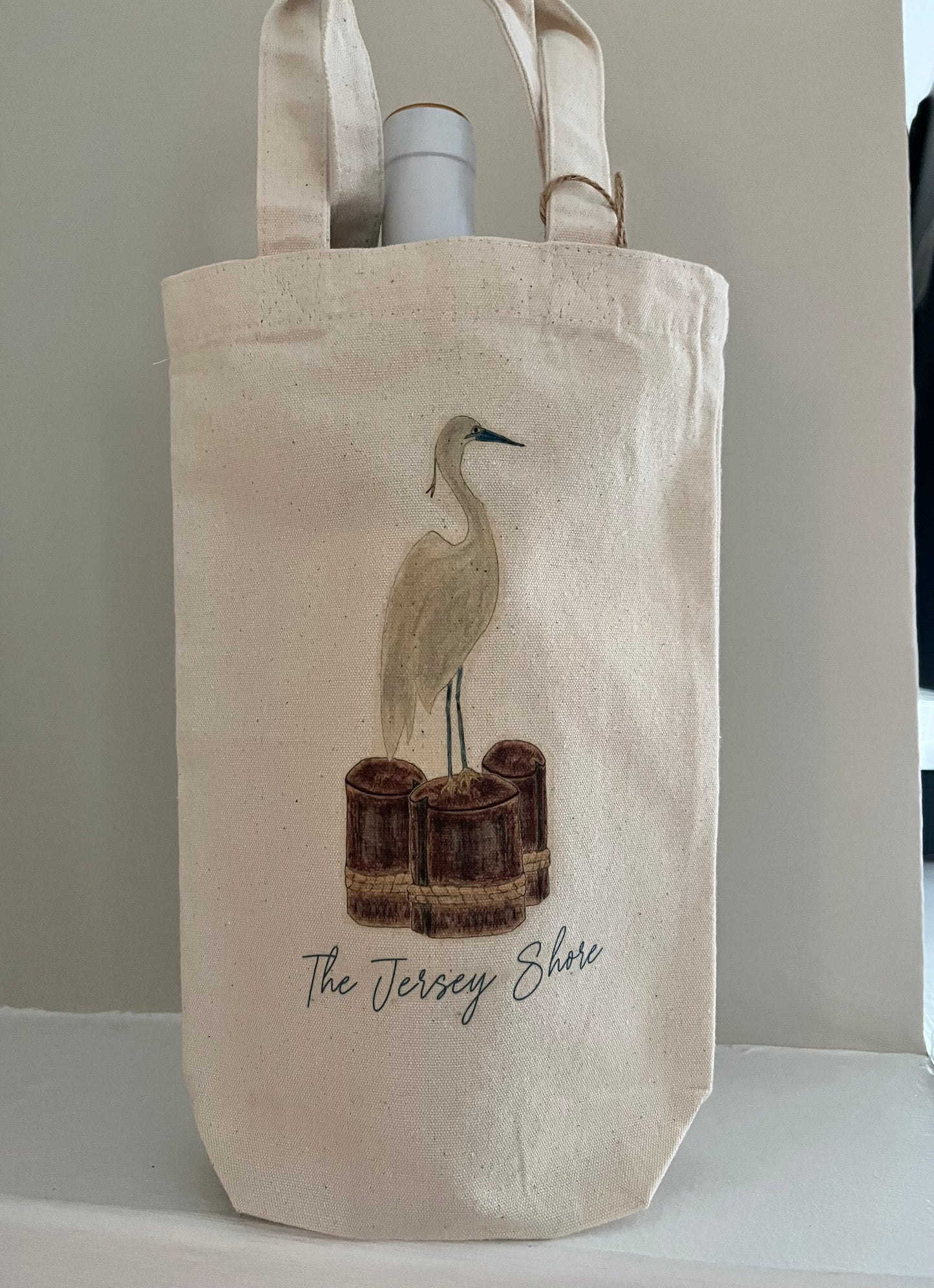 Cotton tote bag with illustrated heron and text 'The Jersey Shore', beach-inspired design