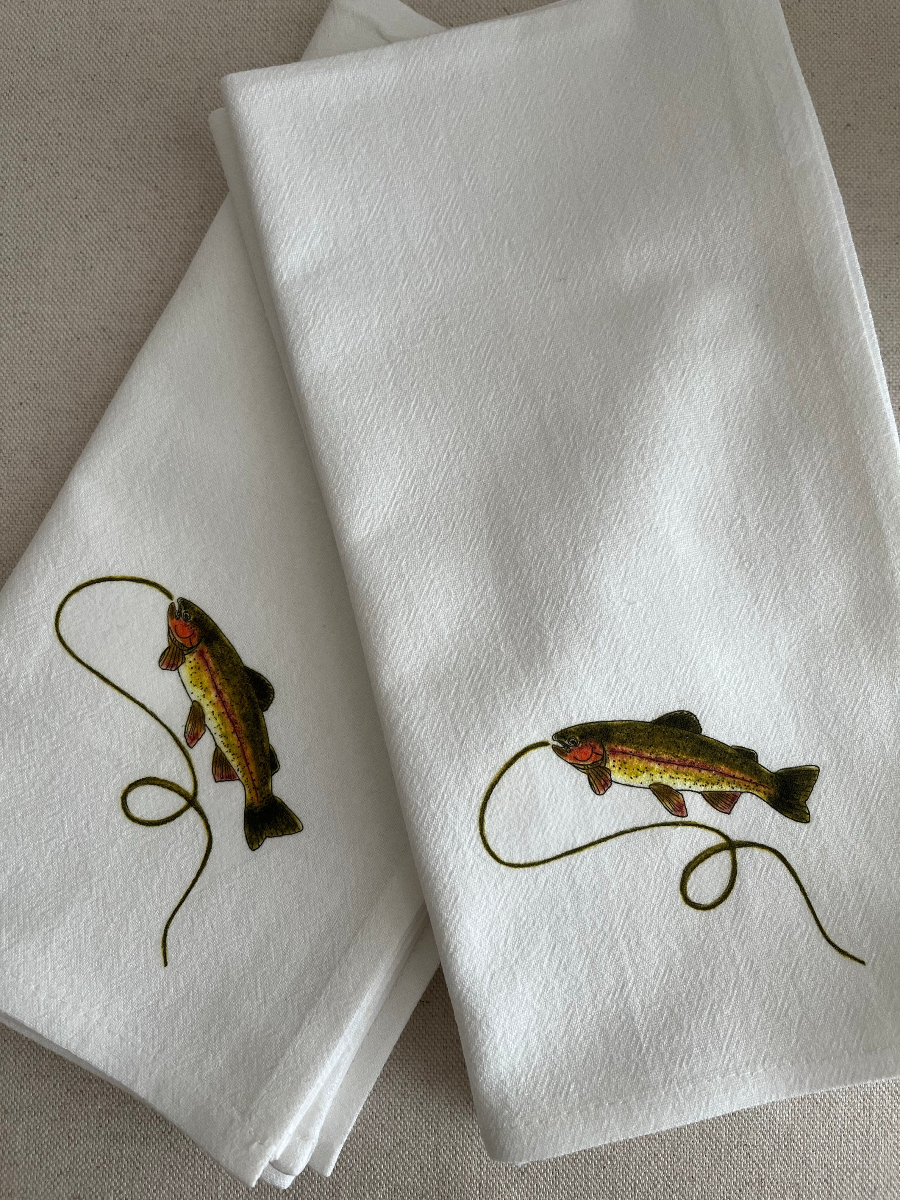 White cotton napkins with trout and fishing line illustration, nature-inspired home decor