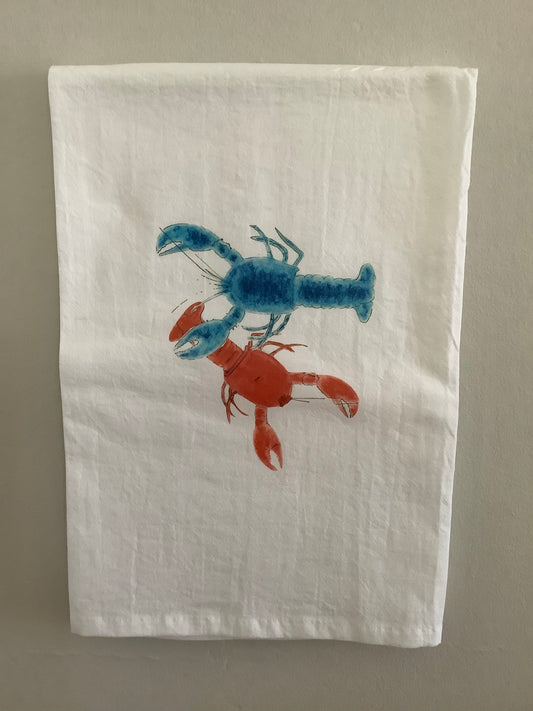 White tea towel with illustrated blue and red lobsters, nature-inspired kitchen decor